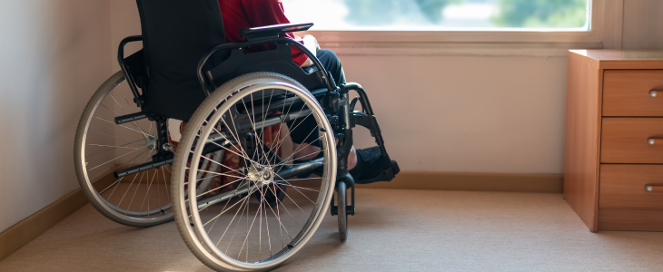 Woman in a wheelchair in the nursing home